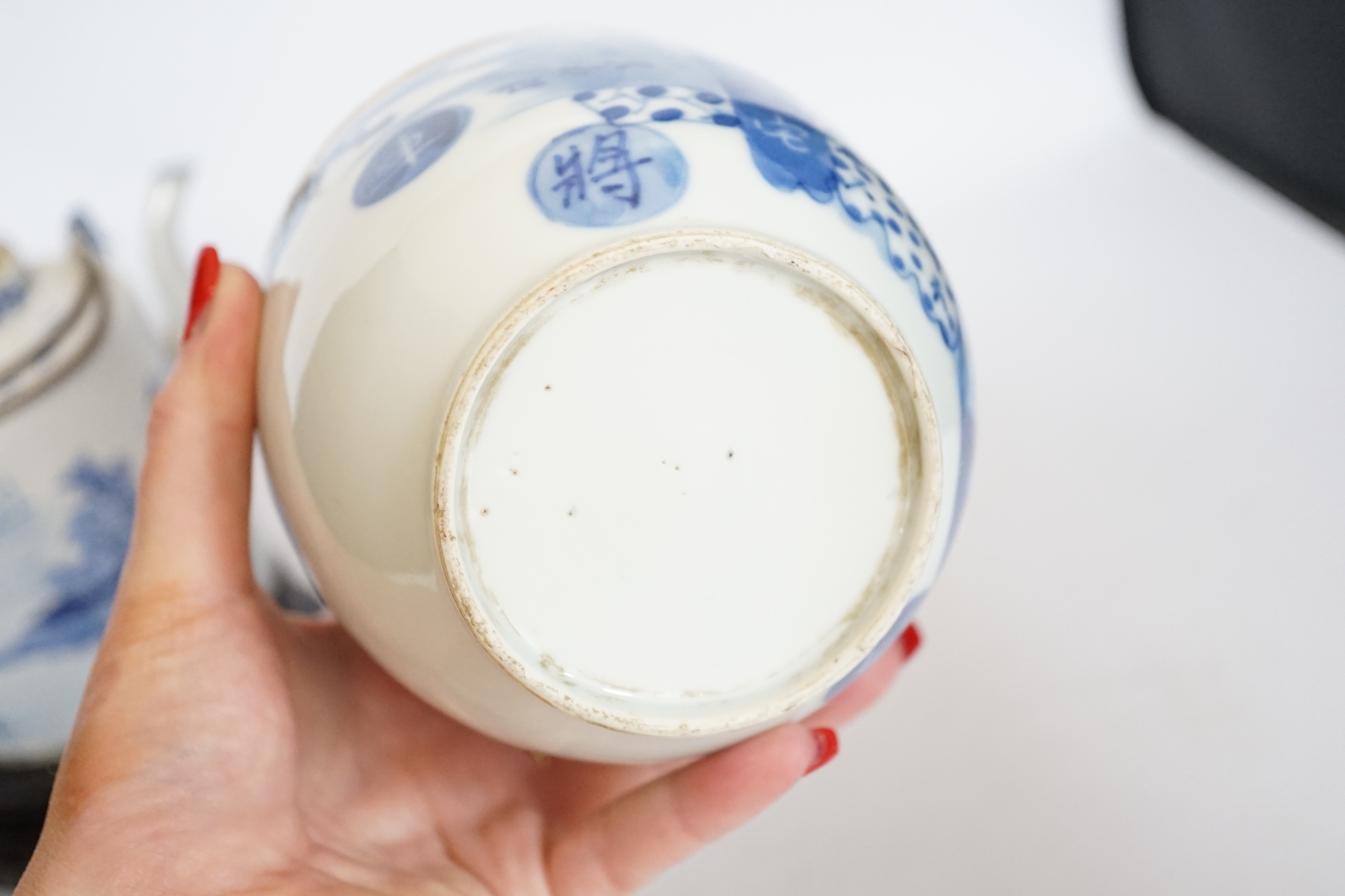 A Chinese Straits blue and white jar and cover, 19th century, a cylindrical teapot and an associated hardwood stand, largest 15cm high